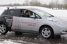 Robotcar driving on ice covered road. 